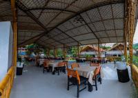 En restaurant eller et andet spisested på Hotel Tulumayo Lodge