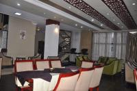 a dining room with a table and chairs at Foyat Hotel in Addis Ababa