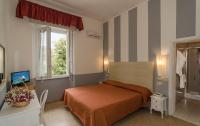 Postel nebo postele na pokoji v ubytování Hotel Le Focette