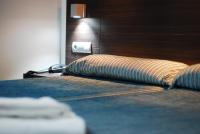 A bed or beds in a room at Hotel Porto Calpe