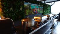 a row of pots on a counter in a restaurant at Hotel Doral Inn in Ibagué