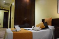 A bed or beds in a room at Hotel Complutense