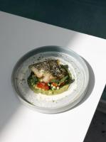 a plate of food on a white table at Hotel Aigue Marine in Tréguier