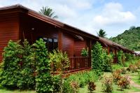 a wooden house with trees in front of it at PingChan Koh Phangan Beachfront Resort in Thong Nai Pan Yai