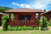 a house with a porch and a deck at PingChan Koh Phangan Beachfront Resort in Thong Nai Pan Yai