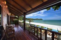 a balcony of a house with a view of the beach at PingChan Koh Phangan Beachfront Resort in Thong Nai Pan Yai