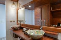 a bathroom with two sinks and a large mirror at PingChan Koh Phangan Beachfront Resort in Thong Nai Pan Yai