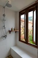 a bathroom with a shower and a window at PingChan Koh Phangan Beachfront Resort in Thong Nai Pan Yai
