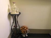a bird cage with a candle and a plant at Amicasa Guesthouse in Hualien City