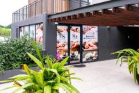 a building with posters on the side of it at Glorystar The Millennial Umhlanga in Durban