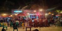 a group of people sitting at a restaurant at night at Viera Resort in Ngurblut