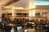 ein Esszimmer voller Tische und Stühle in der Unterkunft Treasure Bay Casino &amp; Hotel-Adults Age 21 and Above in Biloxi