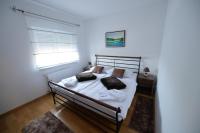 Postel nebo postele na pokoji v ubytování Apartmani Špoljar