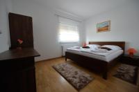 Postel nebo postele na pokoji v ubytování Apartmani Špoljar