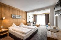 Posteľ alebo postele v izbe v ubytovaní Hotel Gran Ciasa