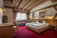 Posteľ alebo postele v izbe v ubytovaní Hotel Gran Ciasa