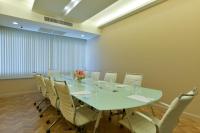 a conference room with a long table and chairs at Hisea Huahin Hotel in Hua Hin