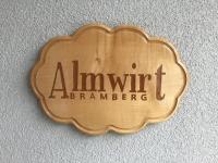 a wooden sign that reads amitt branson on a wall at Almwirt in Bramberg am Wildkogel