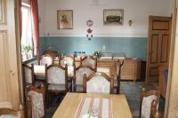 a dining room with a table and chairs at Pension Post in Twiste