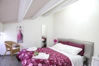 Łóżko lub łóżka w pokoju w obiekcie Villa Antica Aia Relax