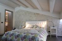 Łóżko lub łóżka w pokoju w obiekcie Villa Antica Aia Relax