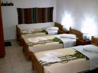 A bed or beds in a room at Summer Lodge