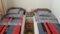 Posteľ alebo postele v izbe v ubytovaní Csokonai guesthouse