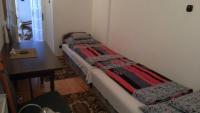 Posteľ alebo postele v izbe v ubytovaní Csokonai guesthouse