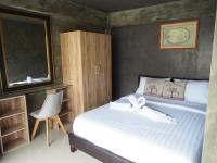 Postel nebo postele na pokoji v ubytování Loft 21 Apartment Romklao