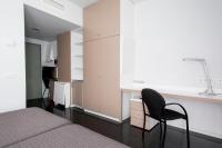Postel nebo postele na pokoji v ubytování Residencia Universitaria Resa Roberto de Nobili