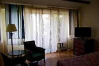 Televízia a/alebo spoločenská miestnosť v ubytovaní Hotel Antico Residence Roma