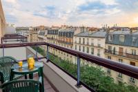 a balcony with a table and chairs and a view at Citadines Bastille Gare de Lyon Paris in Paris