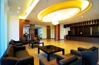 a lobby with couches and tables in a building at JinShan Sakura Bay Hot Spring Hotel in Jinshan