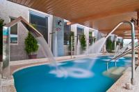 a swimming pool with a water slide at JinShan Sakura Bay Hot Spring Hotel in Jinshan