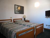 Posteľ alebo postele v izbe v ubytovaní Hotel Rizzi