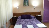 A bed or beds in a room at Hostal San Martin