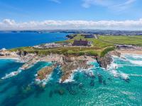 an aerial view of an island in the ocean at The Headland Hotel and Spa in Newquay