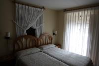 Postel nebo postele na pokoji v ubytování La Casona de Mestas
