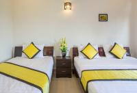 Quynh Chau Homestay Hội Anにあるベッド