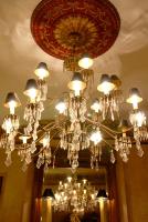 a chandelier hanging from a ceiling in a room at Foley House Inn in Savannah