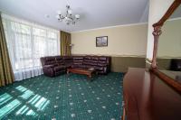 a living room with a couch and a table at Park Hotel Borvikha in Pilichki