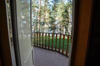 an open door to a balcony with a view of trees at Park Hotel Borvikha in Pilichki