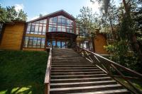 a stairway leading up to a house with a building at Park Hotel Borvikha in Pilichki