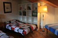 A bed or beds in a room at El Arcon