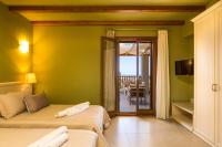 Posteľ alebo postele v izbe v ubytovaní Kallisti Villas, Family Paradise, By ThinkVilla
