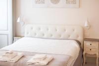 A bed or beds in a room at The Como Secret Garden