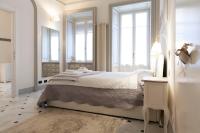 A bed or beds in a room at The Como Secret Garden
