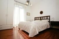 A bed or beds in a room at La Giara del Centro