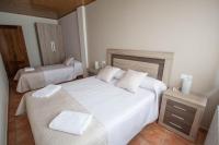 Postel nebo postele na pokoji v ubytování Apartamentos Mirador de Gúdar