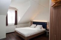 Hotel Alexander Zurich Old Townにあるベッド